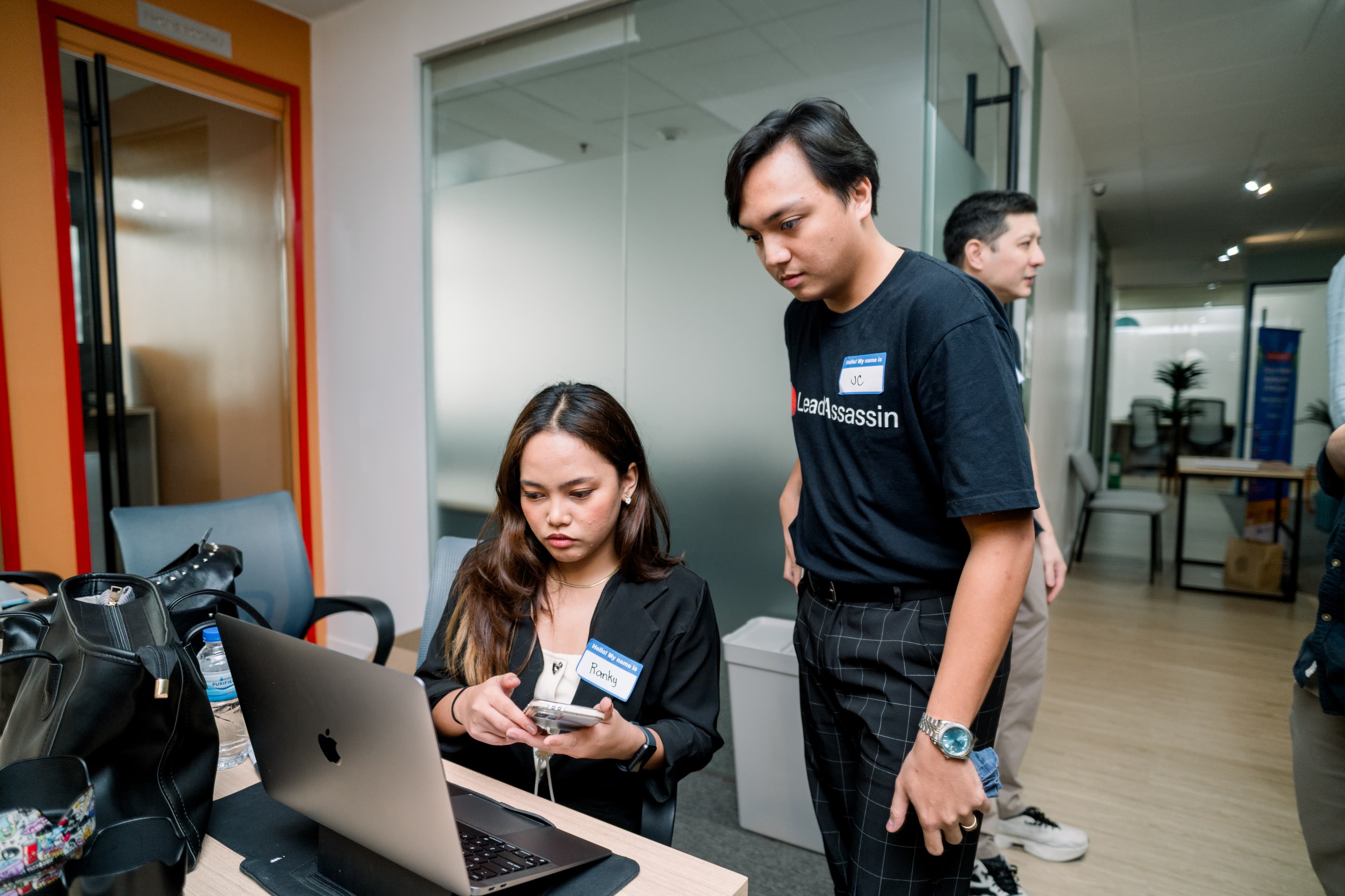 Lead Assassin team members Ranky and JC collaborating on a Clay workflow at a meetup